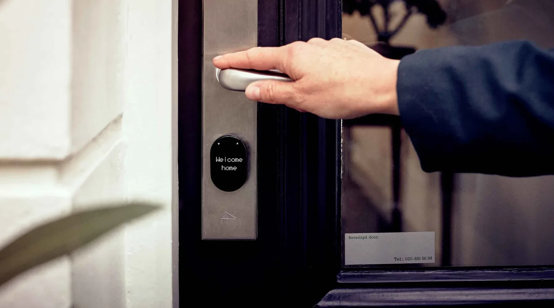 Person unlocking and entering a home