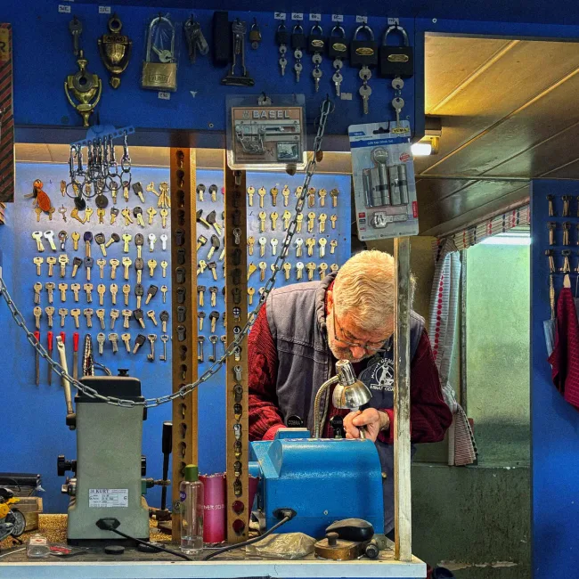 Locksmith working on door hardware