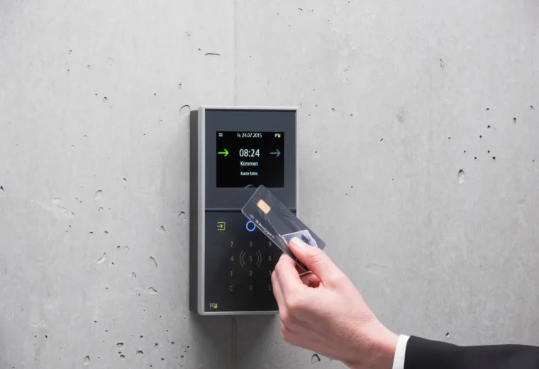 Access card held beside a door reader