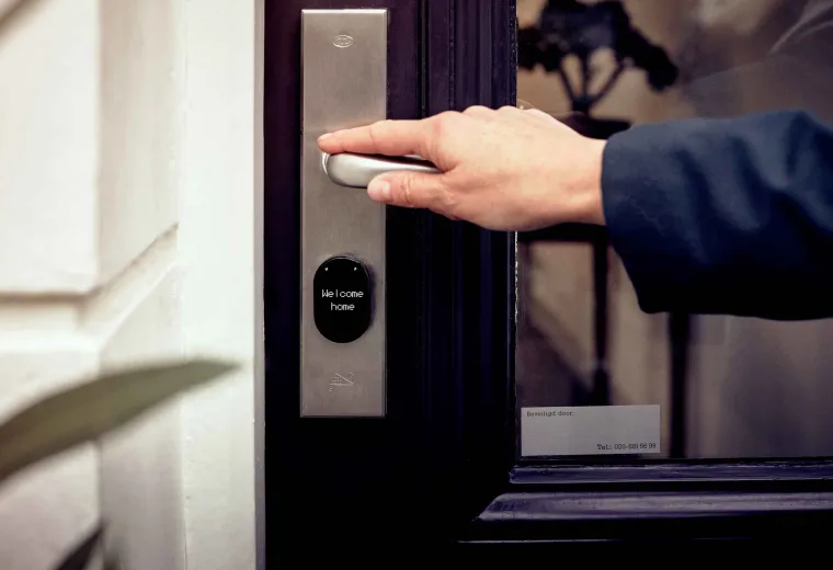 Person unlocking and entering a home